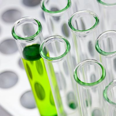 A collection of laboratory test tubes with colored liquid inside