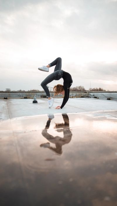 Woman in the middle of a back flip