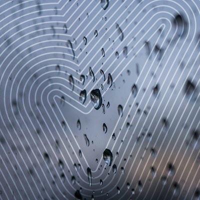 water droplets on glass with the sure tick over the top